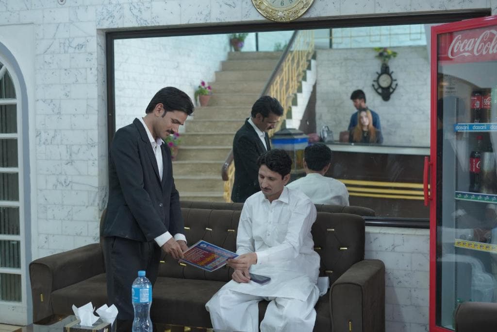 Staff assisting guests at Hotel Silver Sand Multan