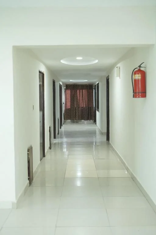 Clean, well-lit hallway at Hotel Silver Sand Multan